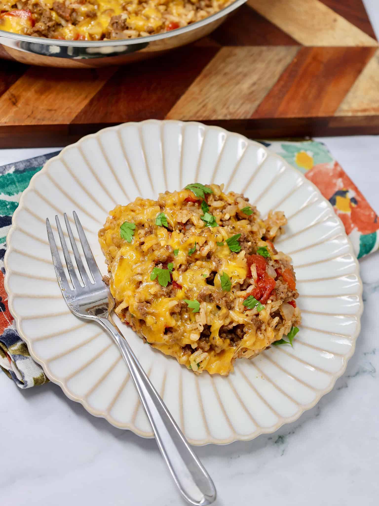 Cheesy ground beef rice recipe with tomatoes and melted cheese