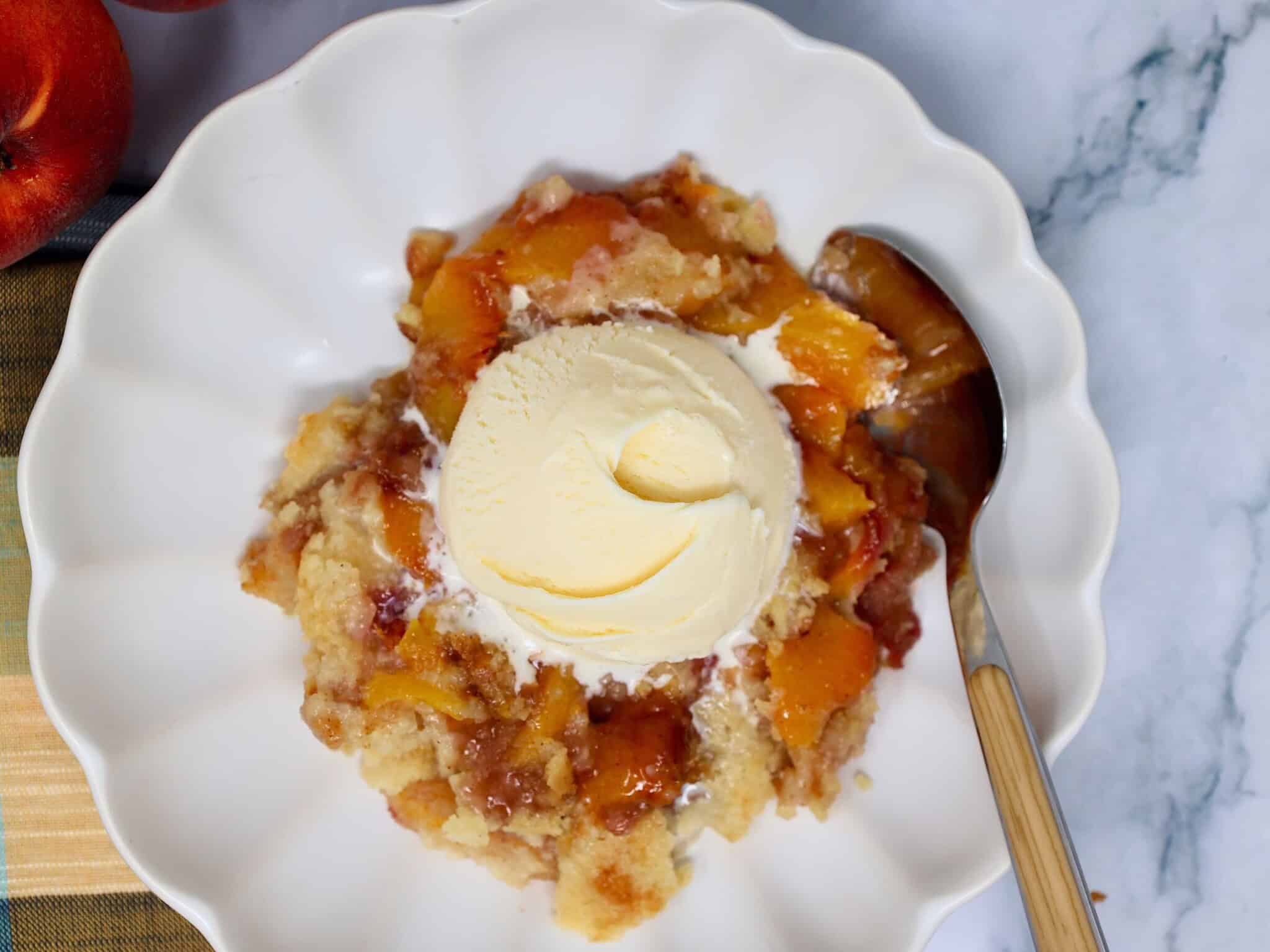 Homemade Fresh Peach Dump Cake ready to serve