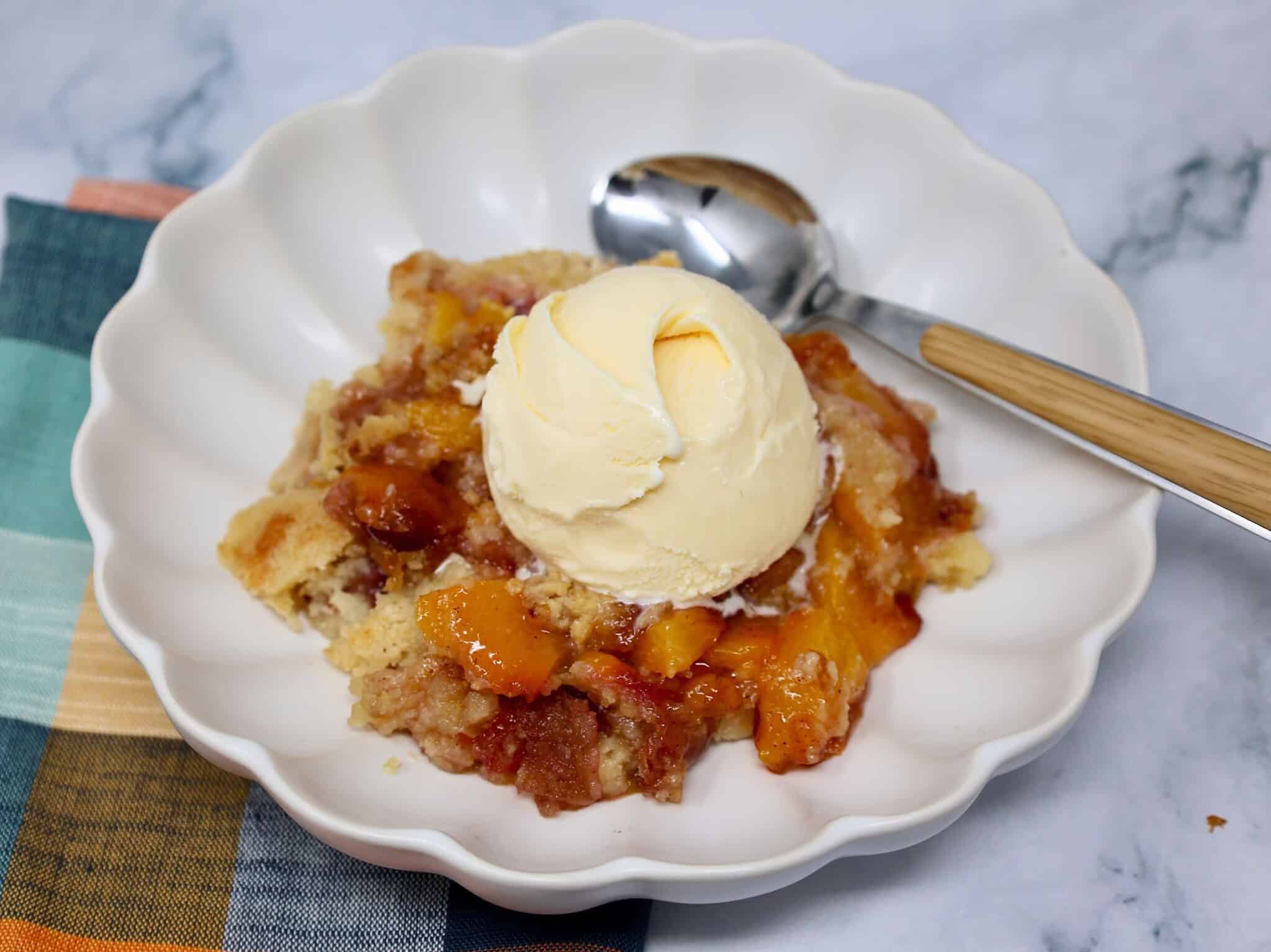 Fresh Peach Dump Cake baked until golden brown and bubbling