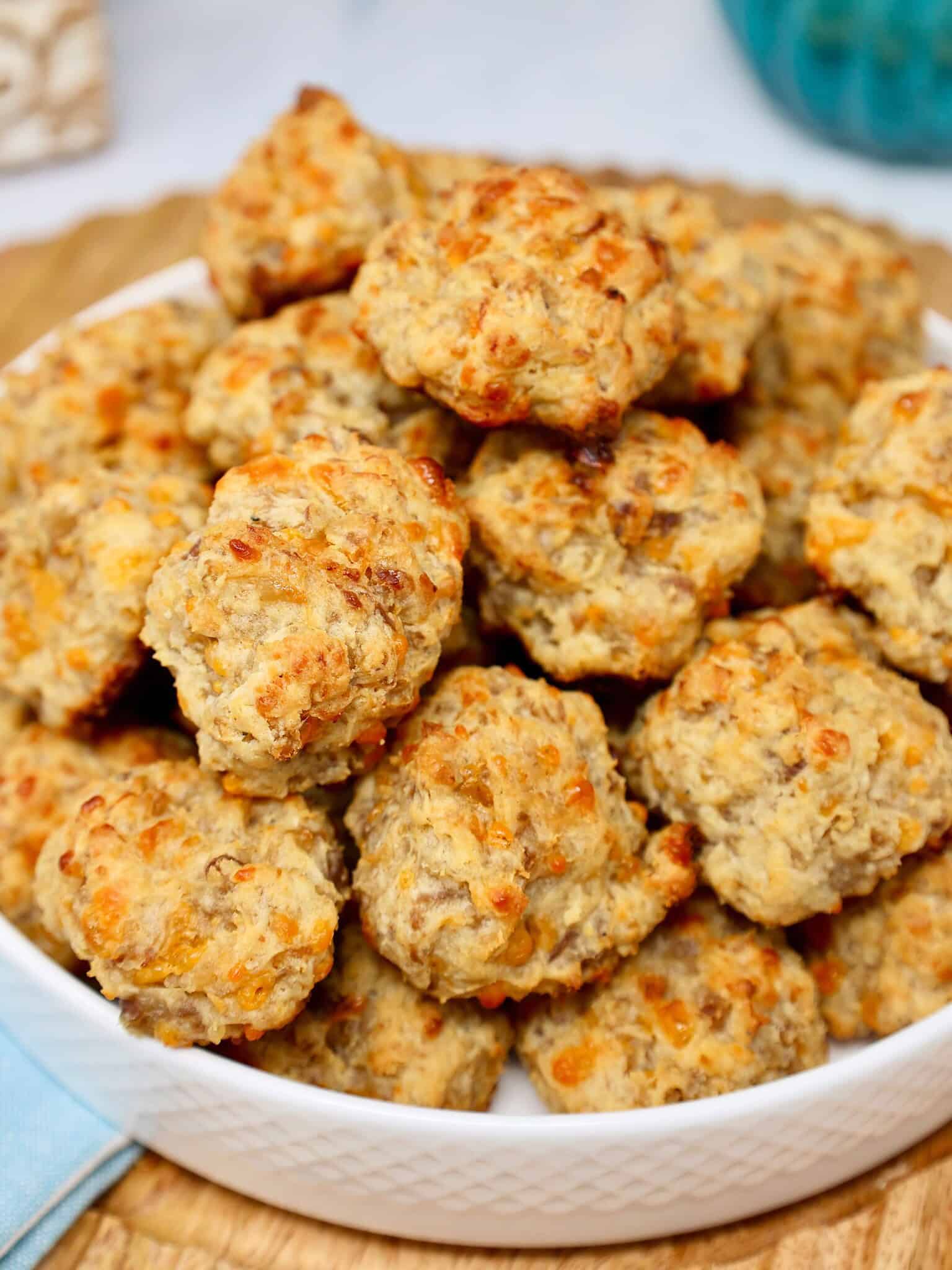 Close up of golden brown maple sausage balls with cheesy centers