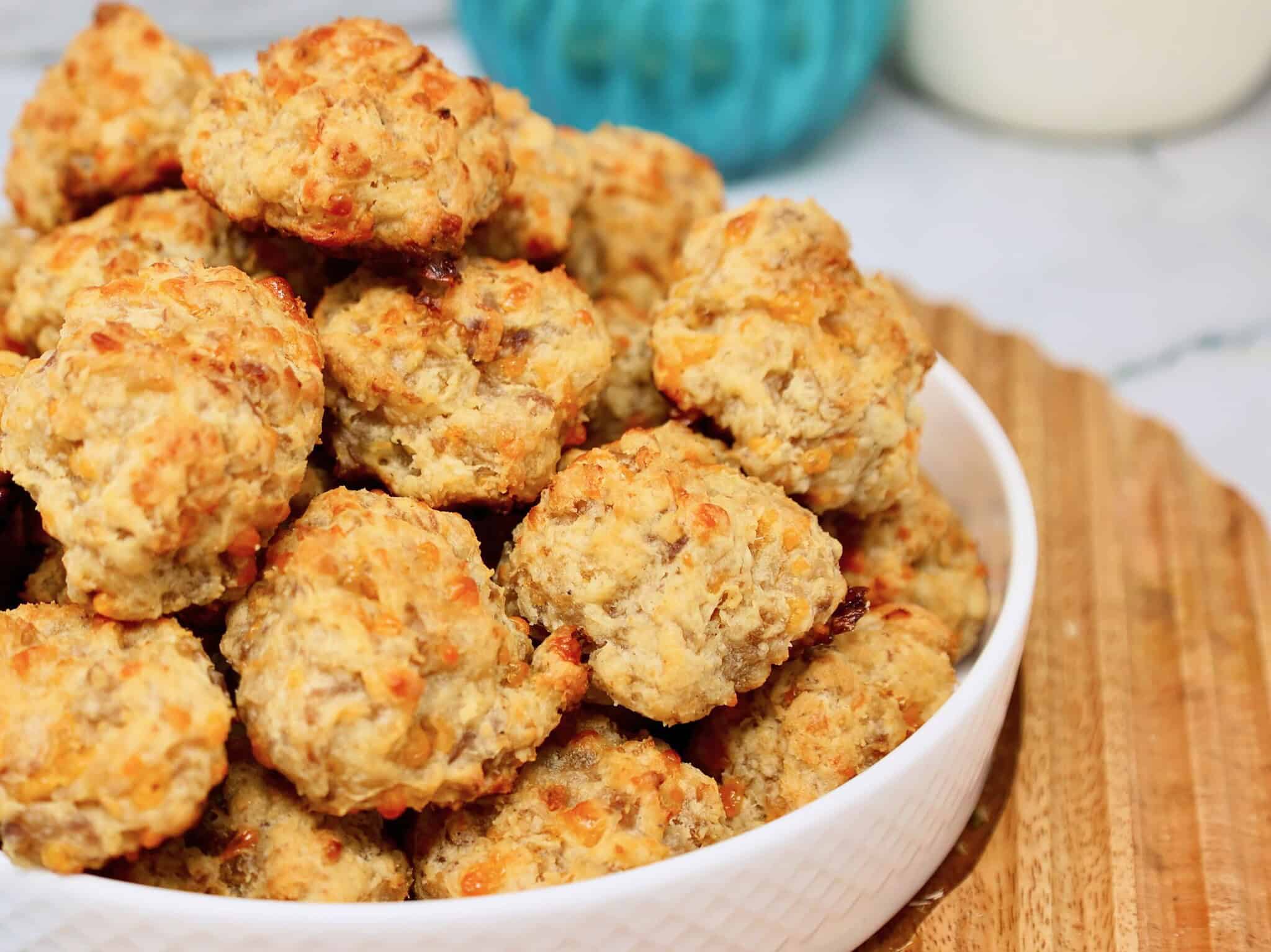 Cream cheese sausage balls served warm with maple syrup for dipping