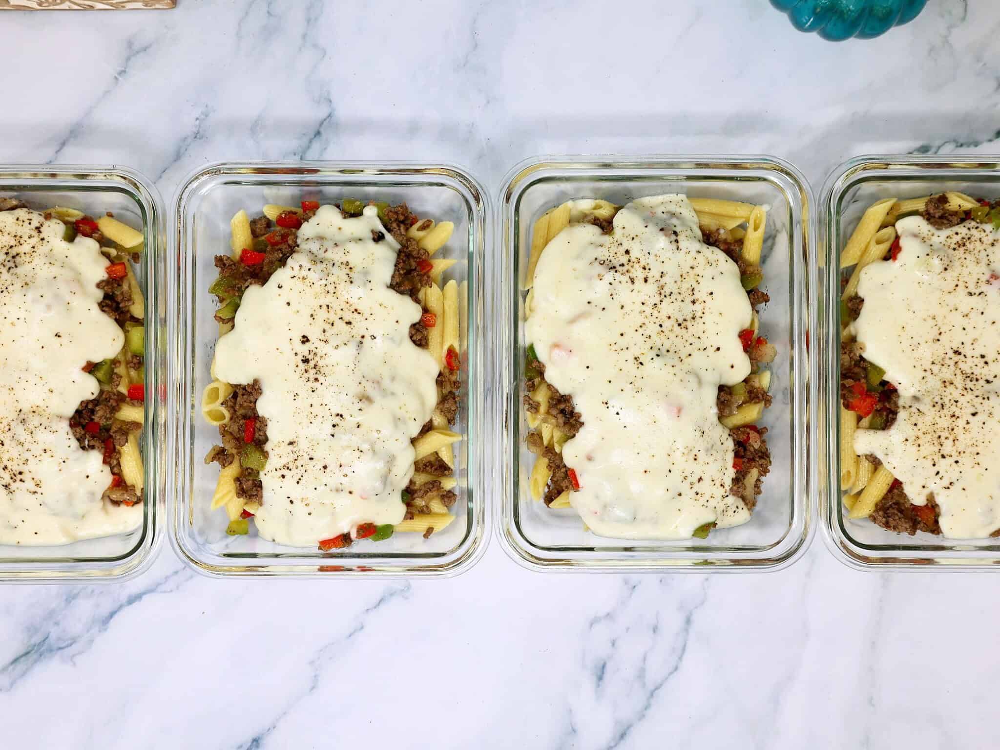 Creamy Philly cheesesteak pasta with penne, seasoned beef, red pepper, and green pepper