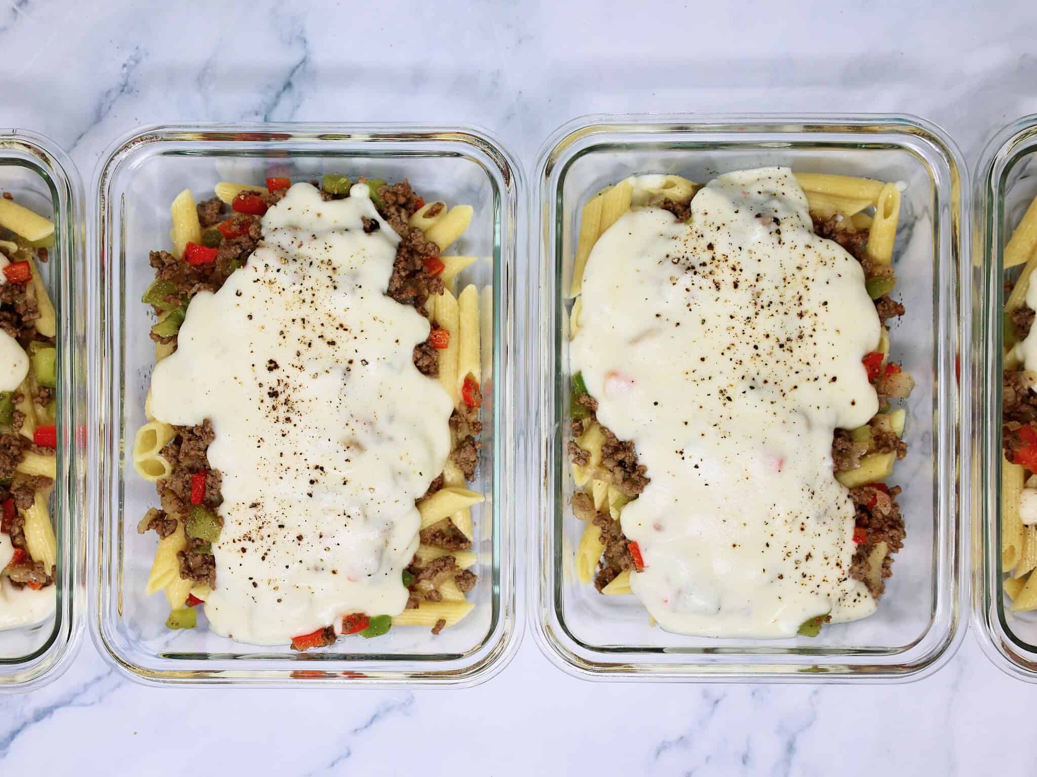 Philly Cheesesteak Pasta Bowl served in a glass meal prep container