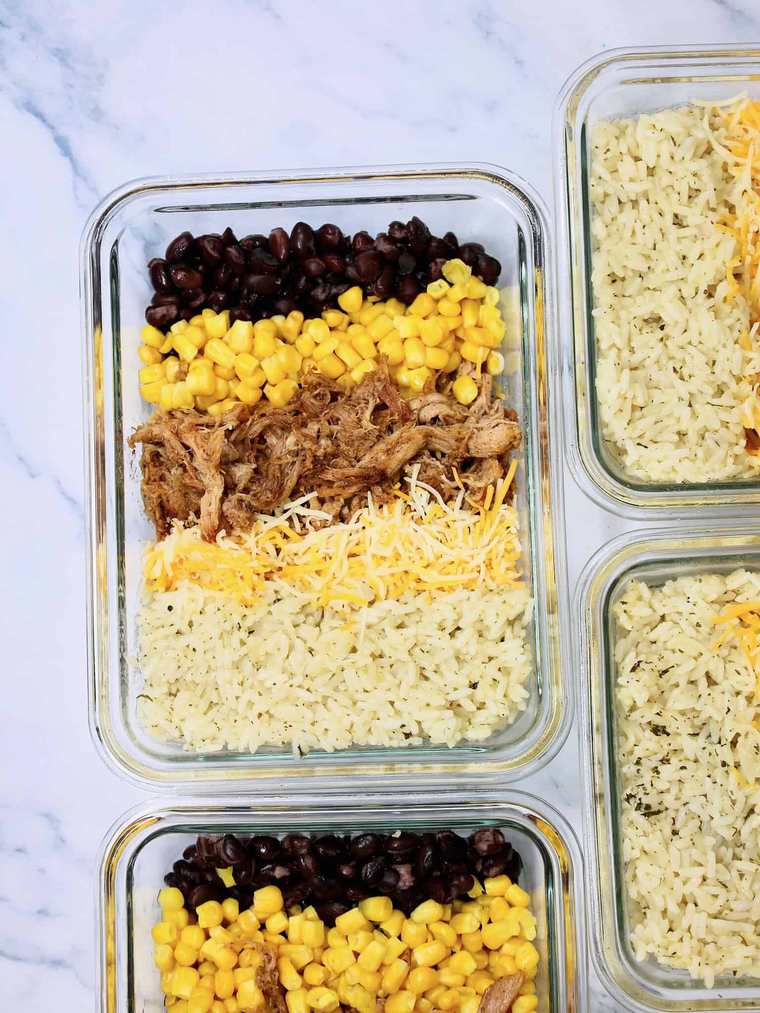 Close up of an easy Mexican pulled pork burrito bowl with colorful toppings