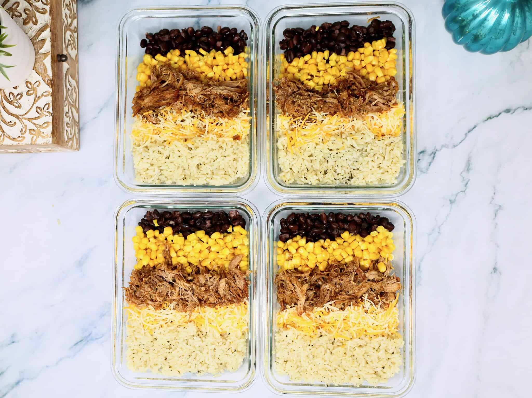 pulled pork burrito bowl with fresh toppings ready to eat