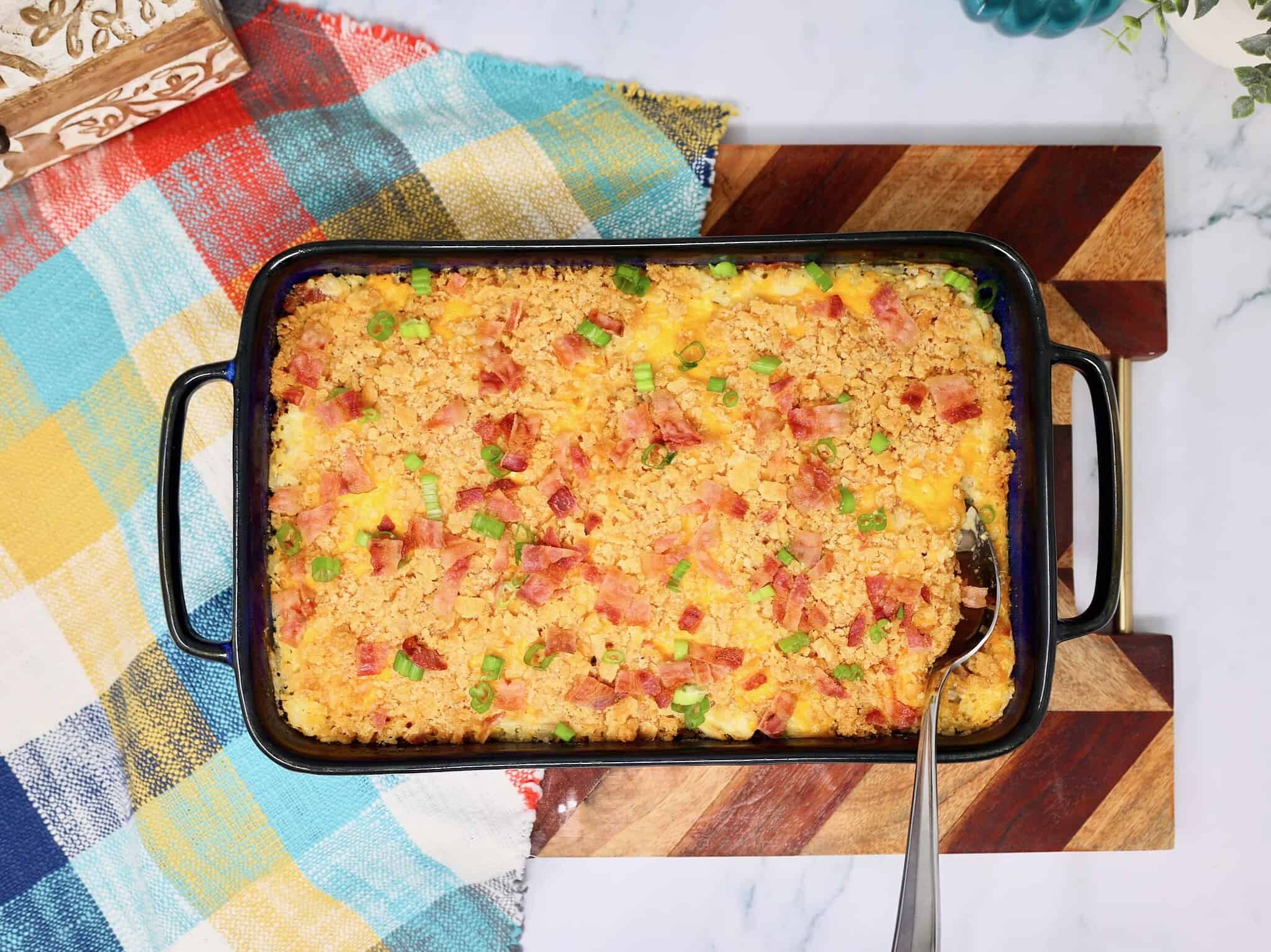 Overhead view of chicken bacon ranch rice casserole topped with crushed Ritz crackers and melted cheddar cheese.