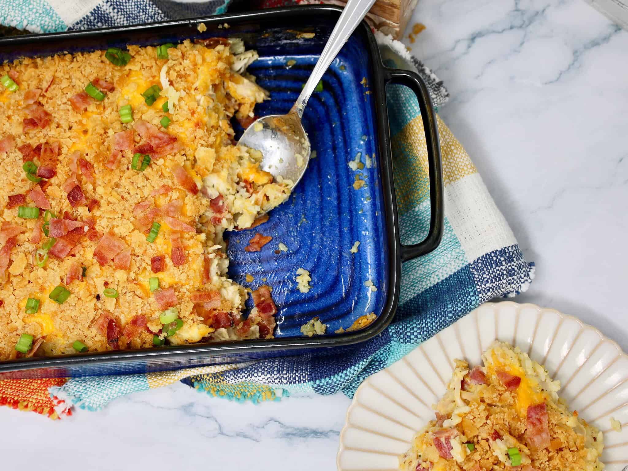 Buttery Ritz cracker crumbs sprinkled over cheesy chicken bacon ranch rice casserole.