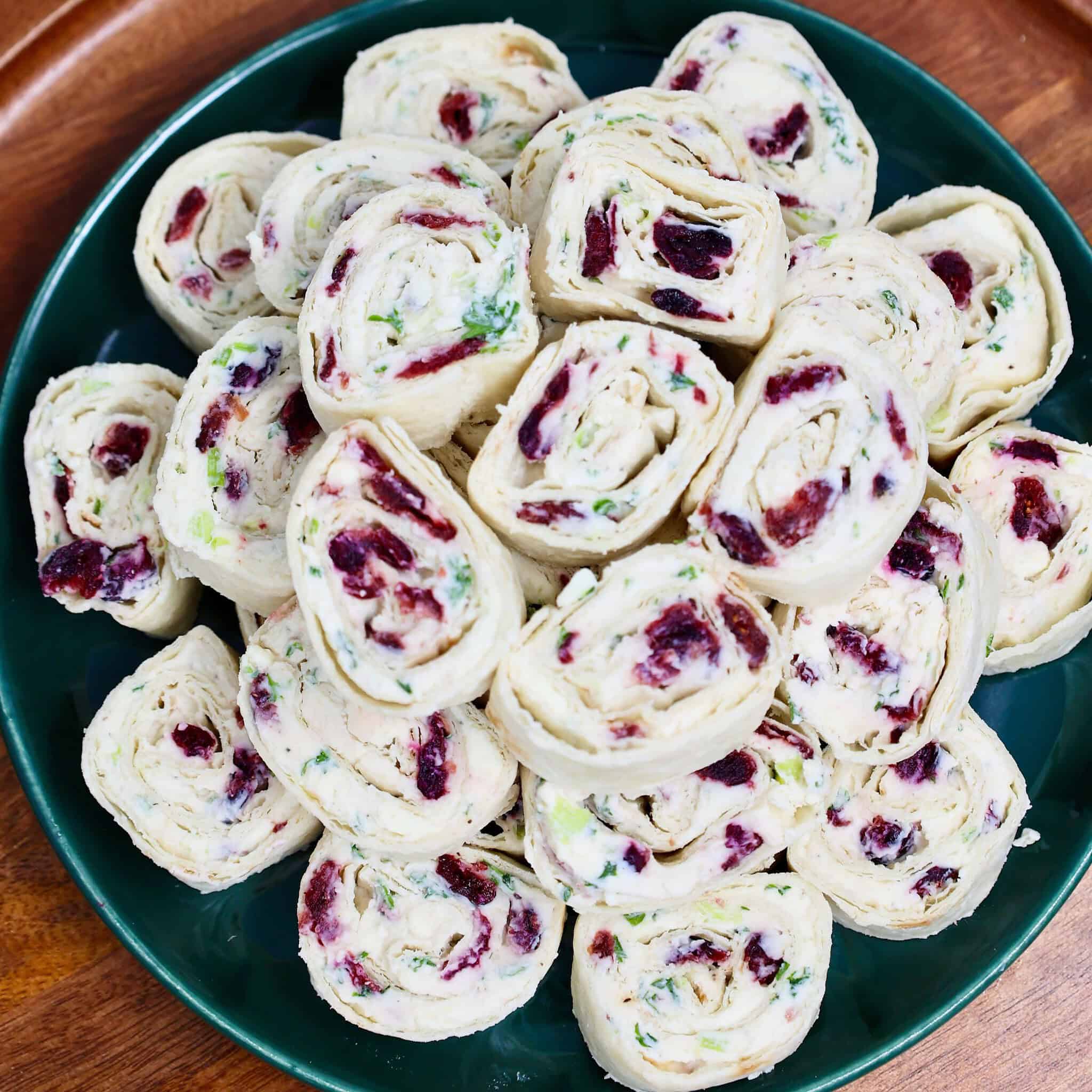 Bite-sized cranberry feta pinwheels ready to refrigerate before serving